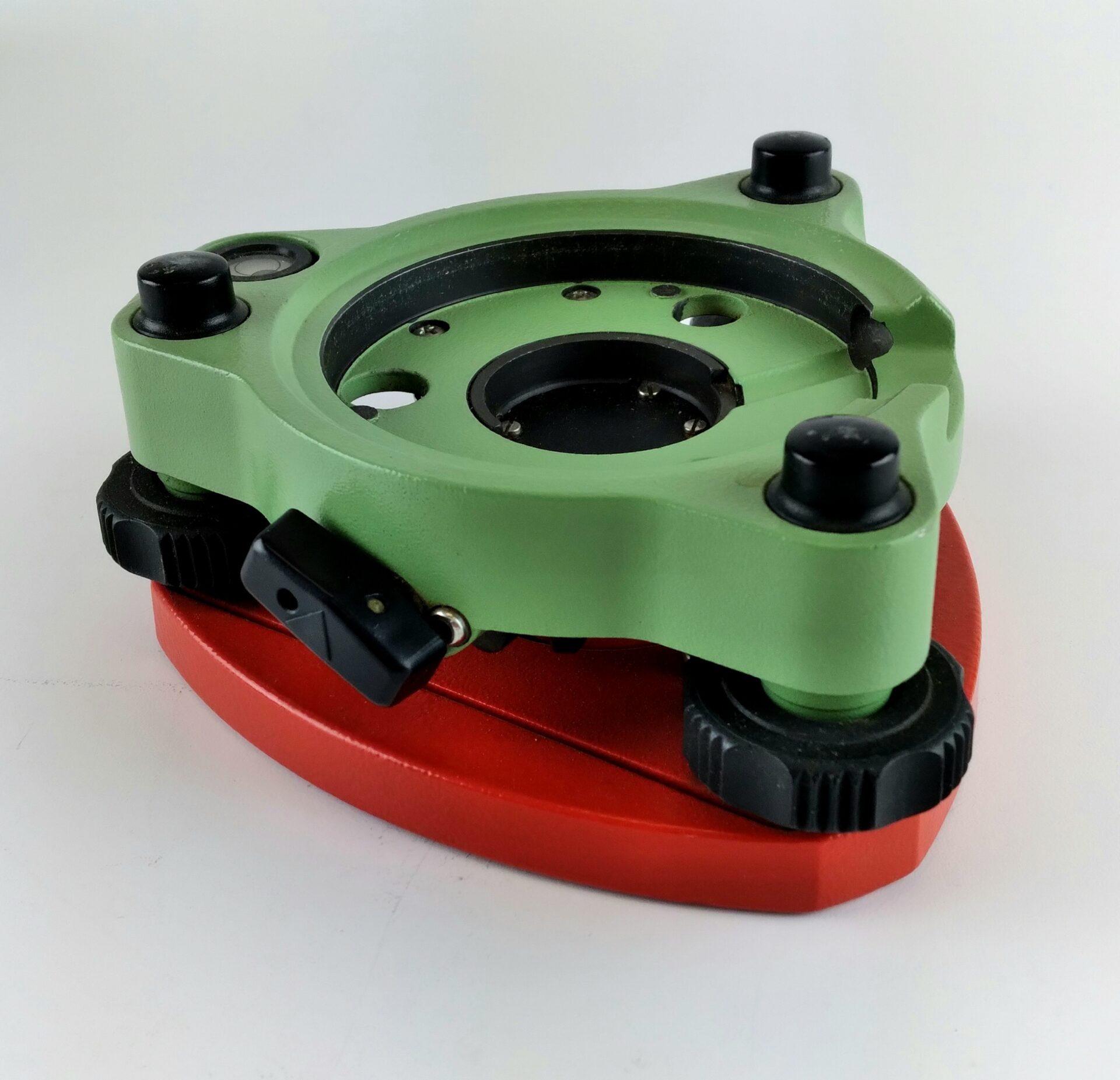 Base nivelante GDF112 BASICO, con plomada optica, color verde o roja.